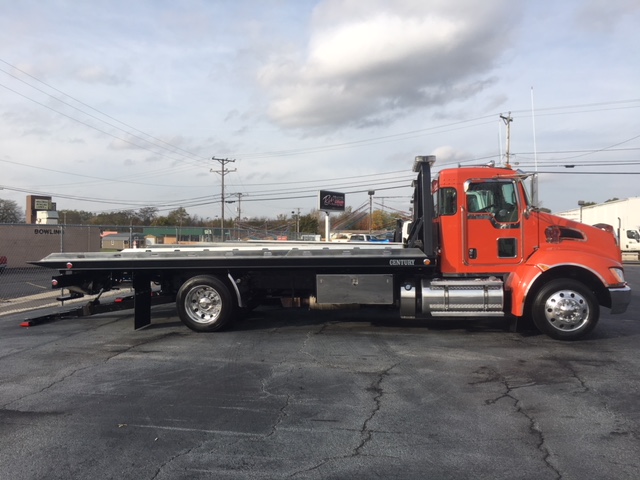 orange flatbed tow truck