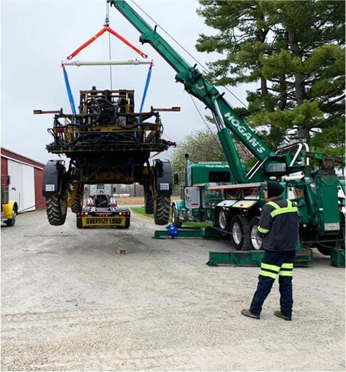 tow truck lifting oversized load truck